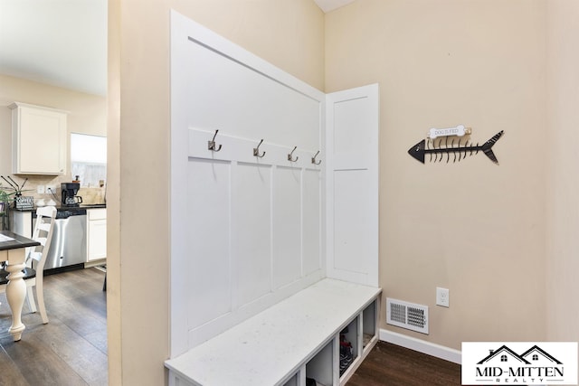 mudroom featuring dark wood-type flooring