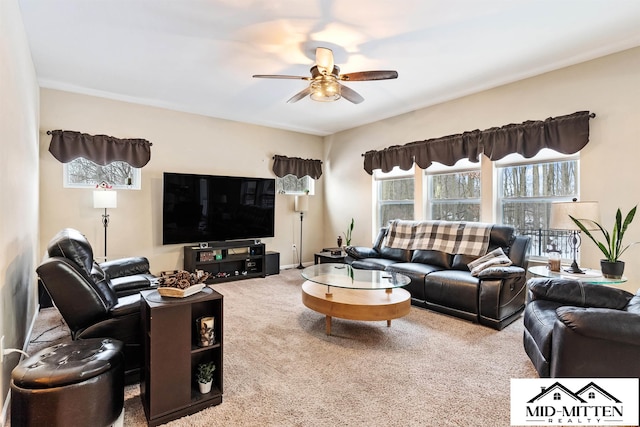 living room with ceiling fan and carpet floors