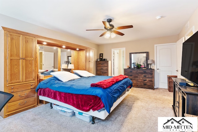 carpeted bedroom featuring ceiling fan