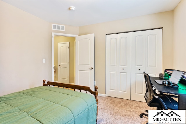 carpeted bedroom with a closet