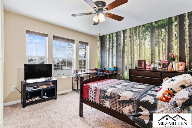 bedroom with ceiling fan and light colored carpet