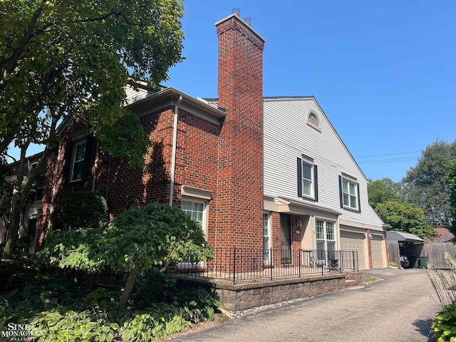 view of side of property with a garage