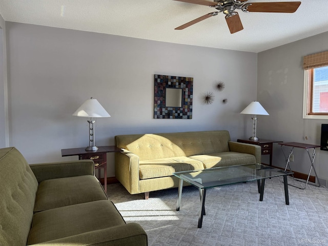 carpeted living room featuring ceiling fan