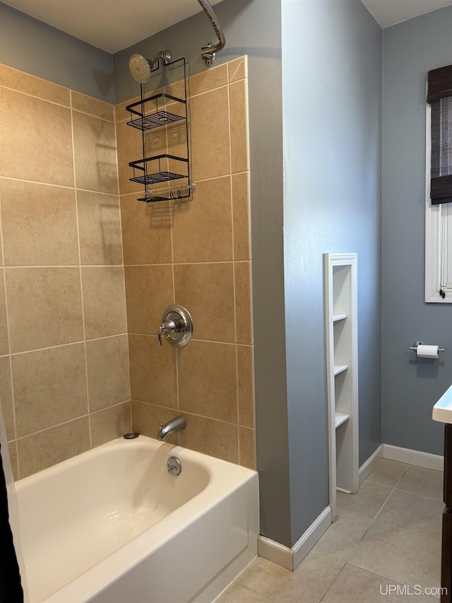 bathroom featuring tiled shower / bath combo and tile patterned floors