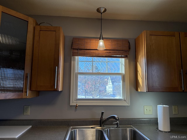 kitchen featuring decorative light fixtures and sink