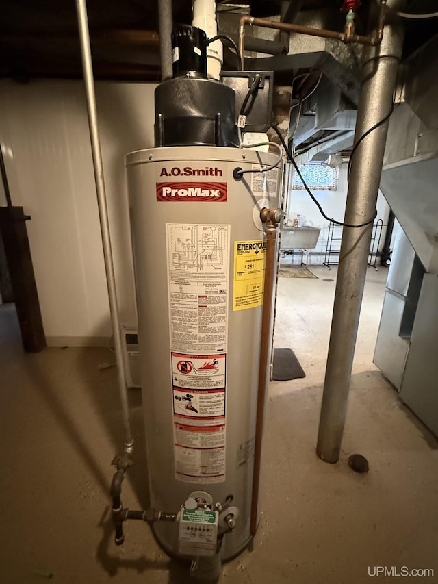 utility room featuring water heater