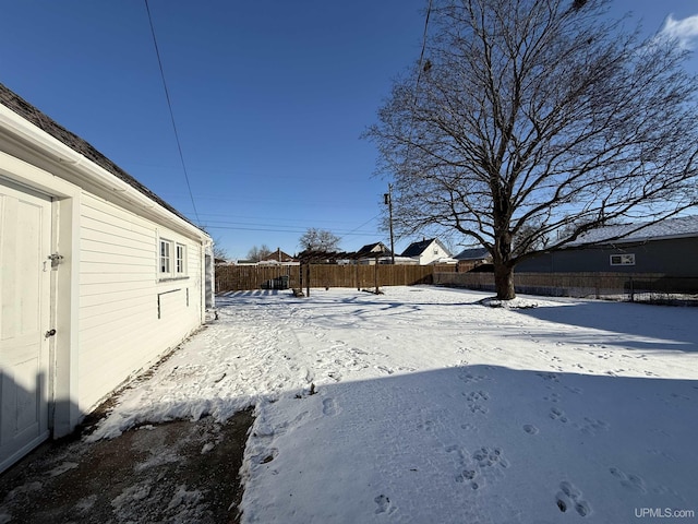 view of yard layered in snow