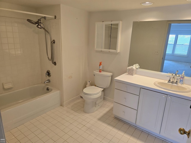 full bathroom featuring toilet, tile patterned flooring, tiled shower / bath, and vanity