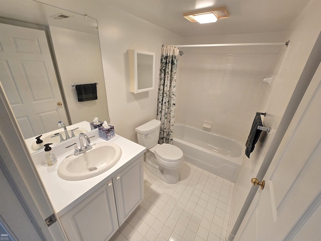 full bathroom with toilet, vanity, tile patterned floors, and shower / bath combo with shower curtain