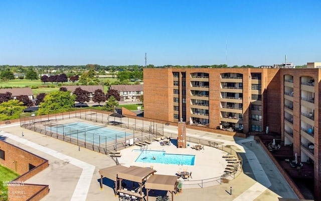 view of swimming pool with a patio