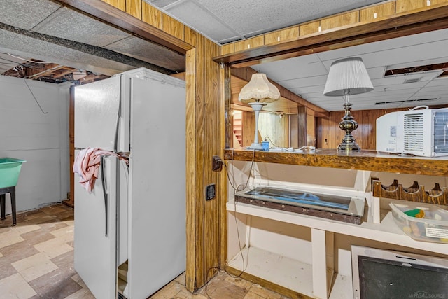 bathroom featuring wood walls