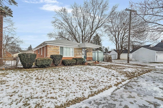 view of front of house featuring a storage unit