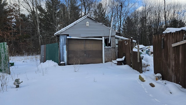 view of snow covered garage