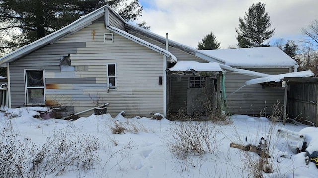 view of snow covered property