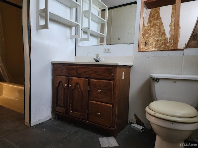 bathroom with toilet and vanity