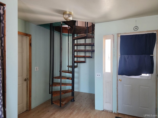 foyer entrance with light wood-type flooring