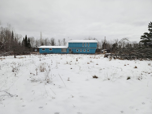 view of snow covered house