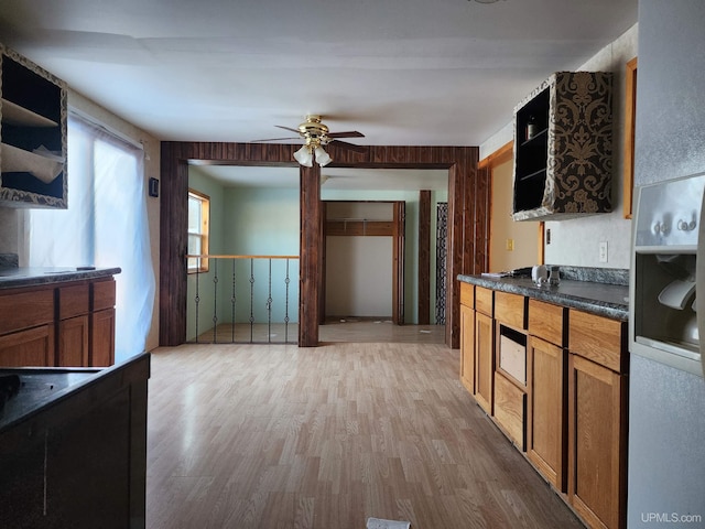 kitchen featuring ceiling fan and light hardwood / wood-style flooring