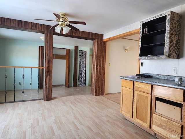 kitchen featuring ceiling fan and light hardwood / wood-style flooring