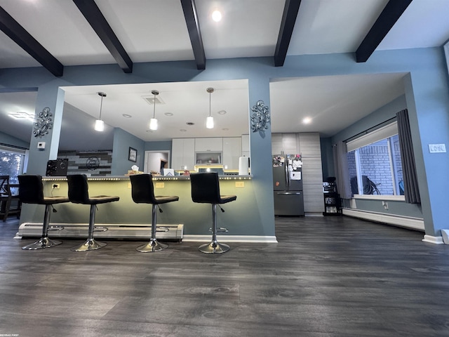 kitchen with a baseboard heating unit, dark wood finished floors, white cabinets, and freestanding refrigerator