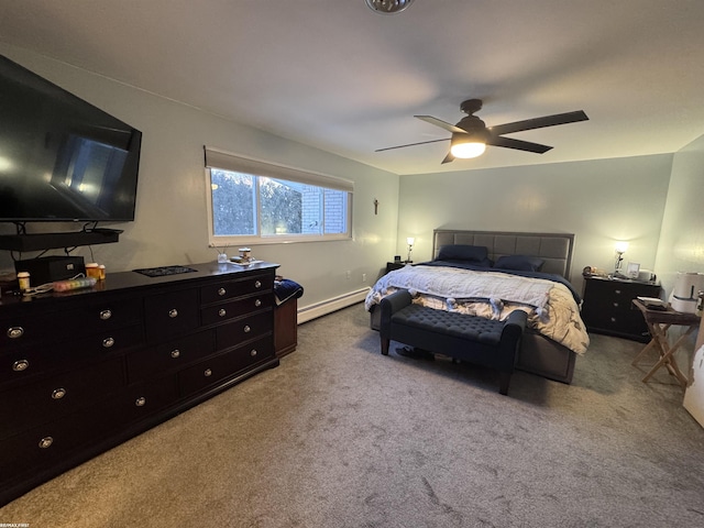 carpeted bedroom with a baseboard heating unit and a ceiling fan