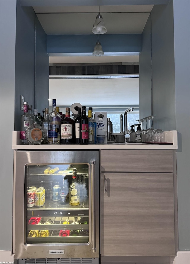 bar with wine cooler and a bar