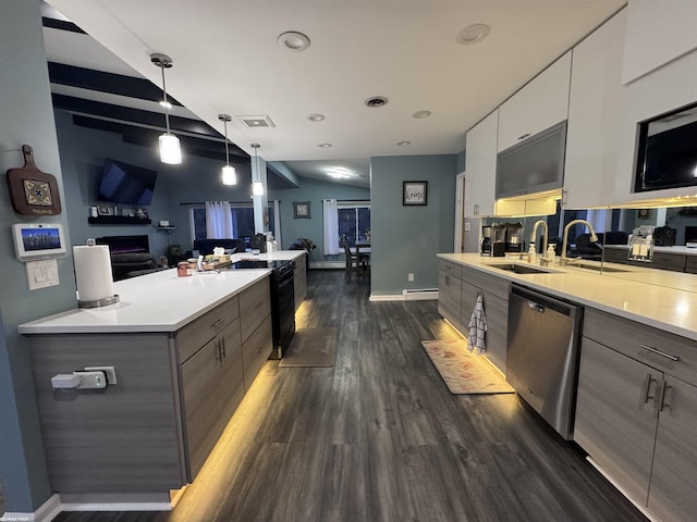 kitchen featuring modern cabinets, a sink, stainless steel dishwasher, light countertops, and dark wood-style flooring