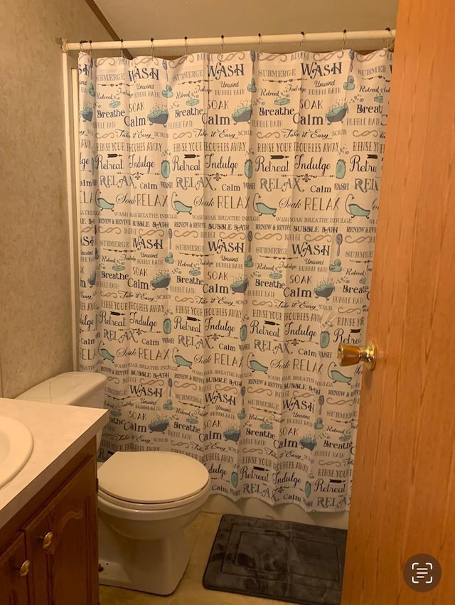 bathroom featuring tile patterned floors, toilet, vanity, and a shower with shower curtain