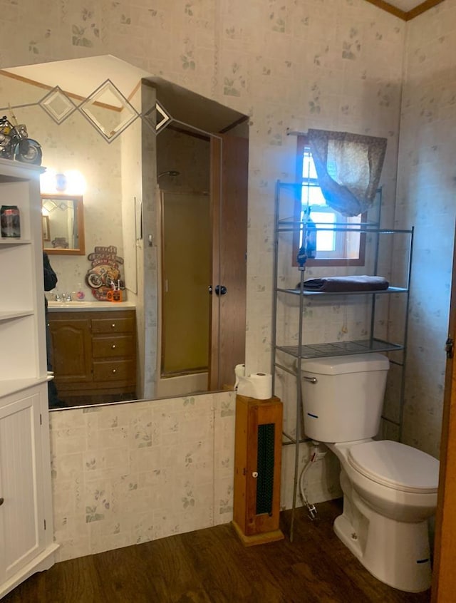 bathroom featuring hardwood / wood-style flooring and toilet