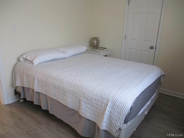 bedroom featuring dark wood-type flooring