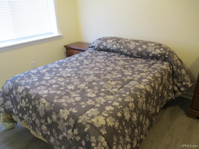 bedroom featuring wood-type flooring