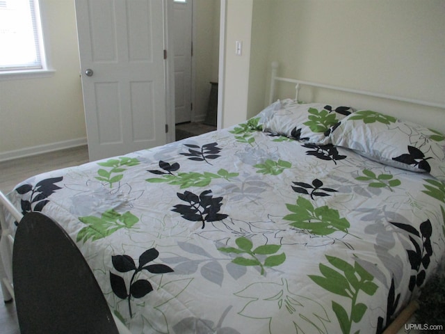 bedroom featuring hardwood / wood-style flooring