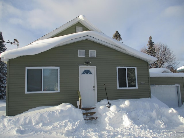 view of front of home with a garage