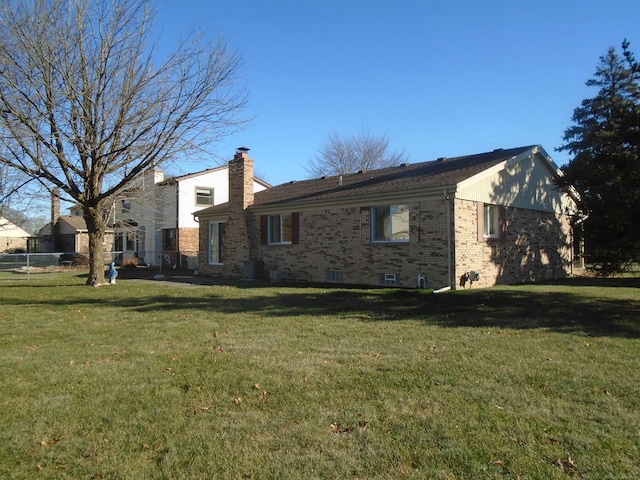 view of side of home featuring a lawn