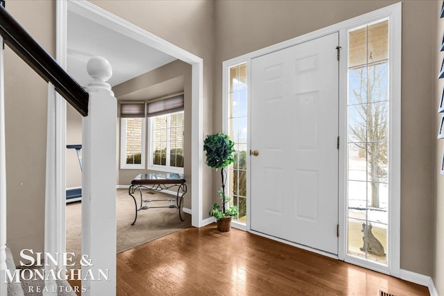 entrance foyer featuring hardwood / wood-style flooring