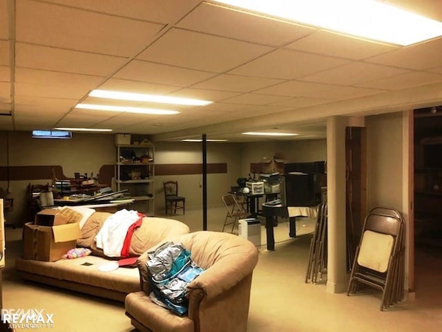 basement featuring a paneled ceiling