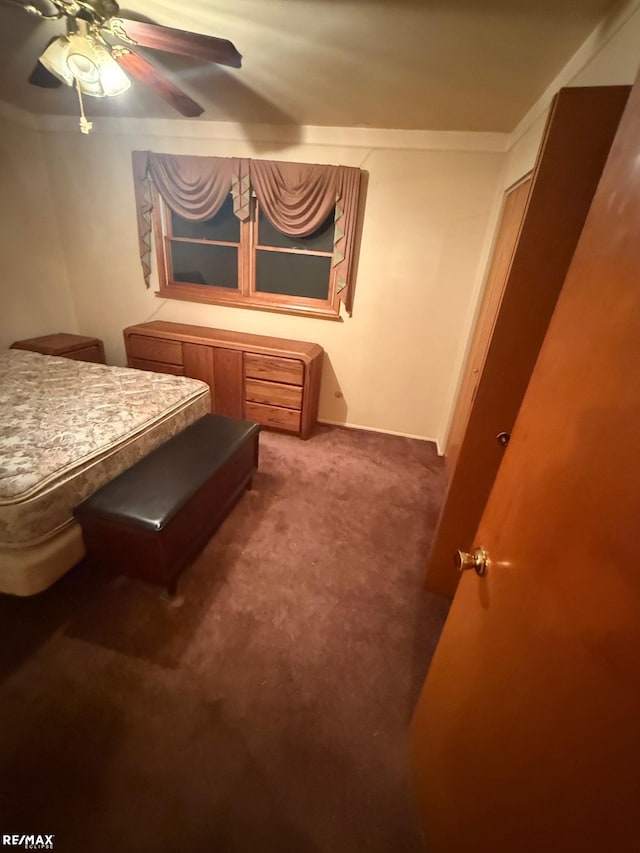 bedroom featuring ornamental molding, carpet, and ceiling fan