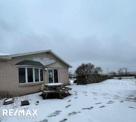 view of snow covered house