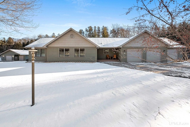 ranch-style home featuring a garage