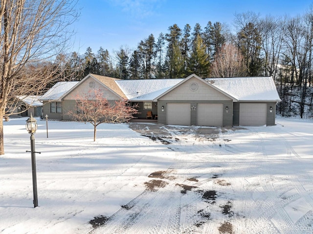 single story home featuring a garage