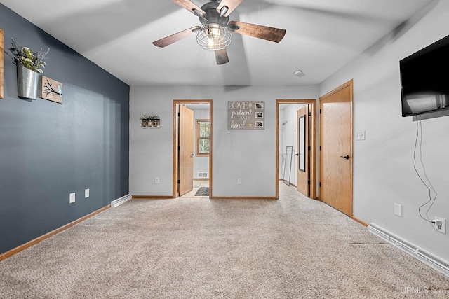 unfurnished bedroom featuring ceiling fan, ensuite bathroom, and carpet flooring