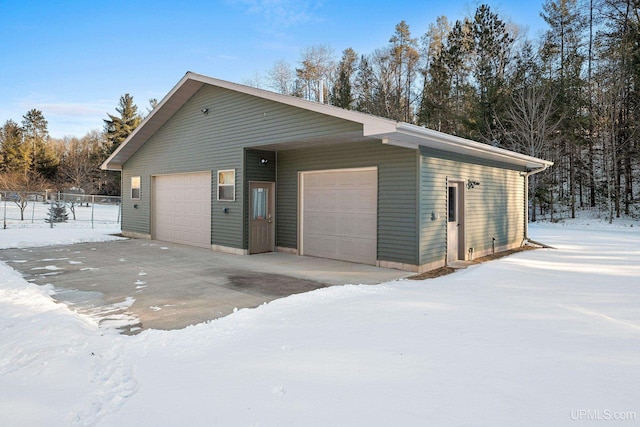 view of snow covered garage