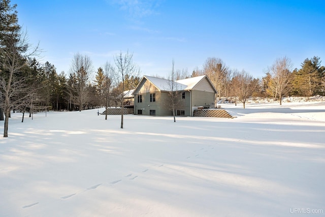 view of snow covered property