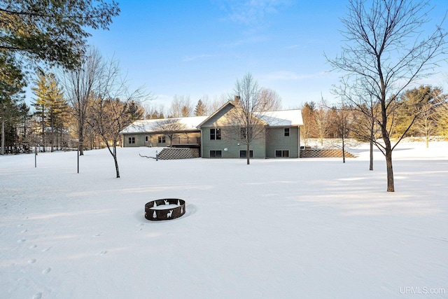 snowy yard with a fire pit