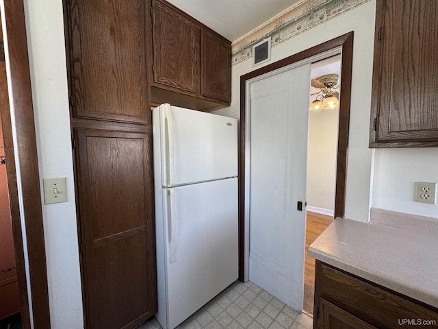 kitchen featuring white refrigerator