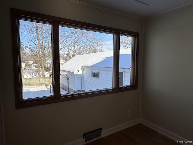 interior space featuring crown molding and hardwood / wood-style flooring