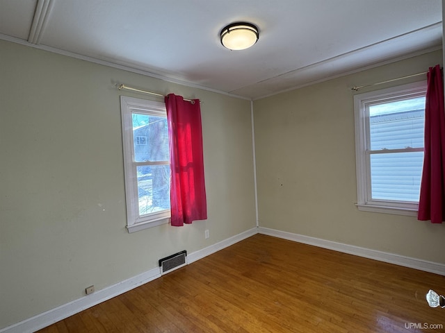 spare room featuring hardwood / wood-style floors