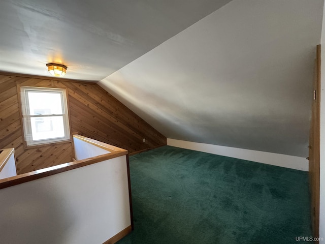 additional living space with lofted ceiling and carpet flooring