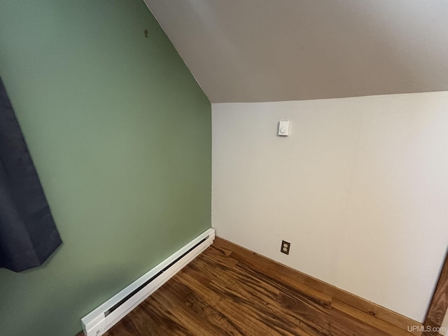 interior space with a baseboard radiator and hardwood / wood-style floors