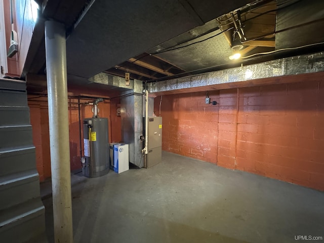 basement featuring heating unit and gas water heater